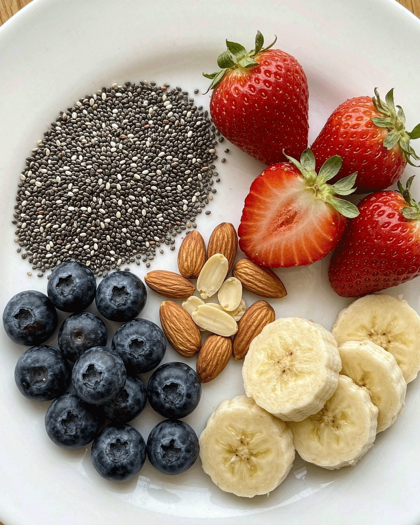 Clean-label ingredients — chia seeds, strawberries, blueberries, almonds, bananas