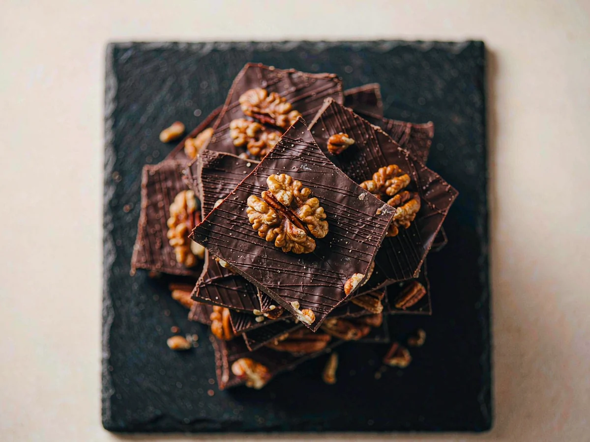 Dark chocolate pecan bark with toasted pecans, broken pieces