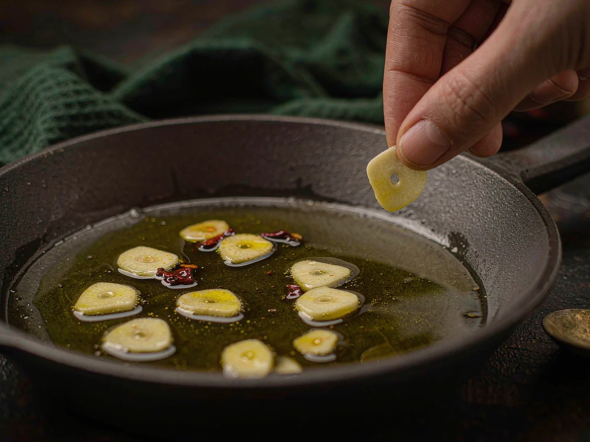 A Light Feast of the Seven Fishes Pasta - Toast the garlic in olive oil