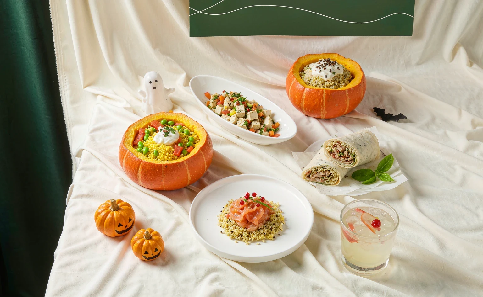 Oriental Bite Halloween light-meal spread — pumpkin millet bowl, salmon quinoa bowl, herbal tofu bowl, chicken wrap and oolong kombucha