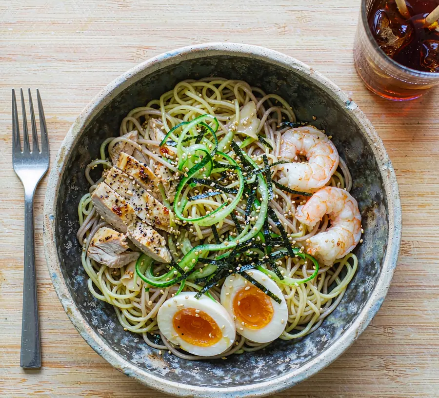 Buckwheat soba noodle salad in a stoneware bowl