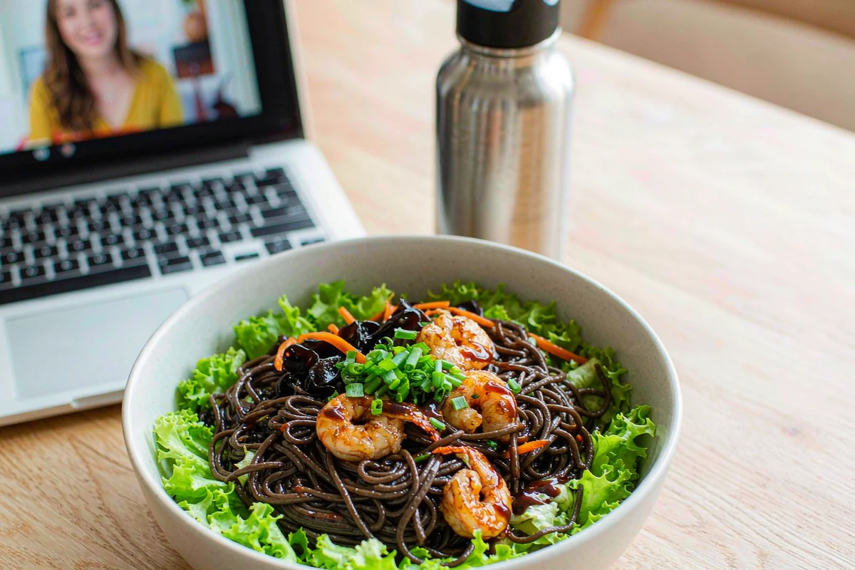 Lifestyle shot — soba bowl on wooden table with greenery